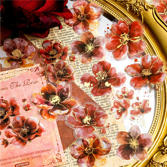 Flat lay of gold foil floral stickers – various designs for DIY crafts and scrapbooking.