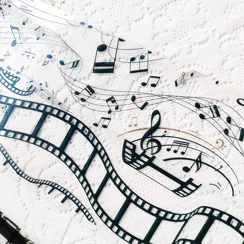 Layering pages with music note and film frame PET tape
