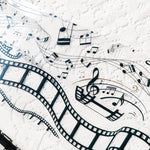 Layering pages with music note and film frame PET tape