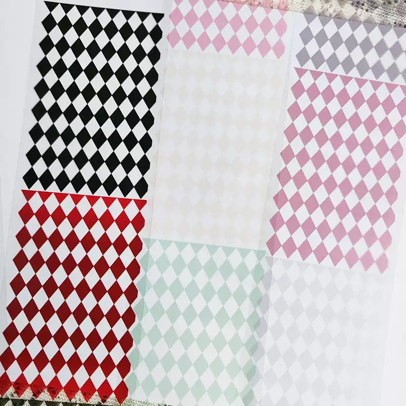 Flat lay of colorful diamond grid PET tape rolls
